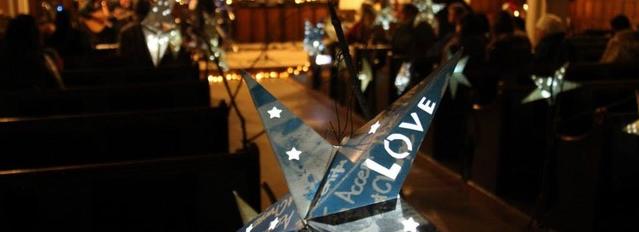 interior of church in Barnsley with a fiary lights and a paper lantern with the word "love" on in the foreground