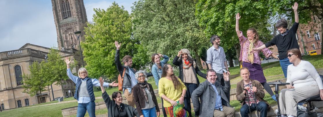 The LENs steering group and directors pose by a green space in central Derby