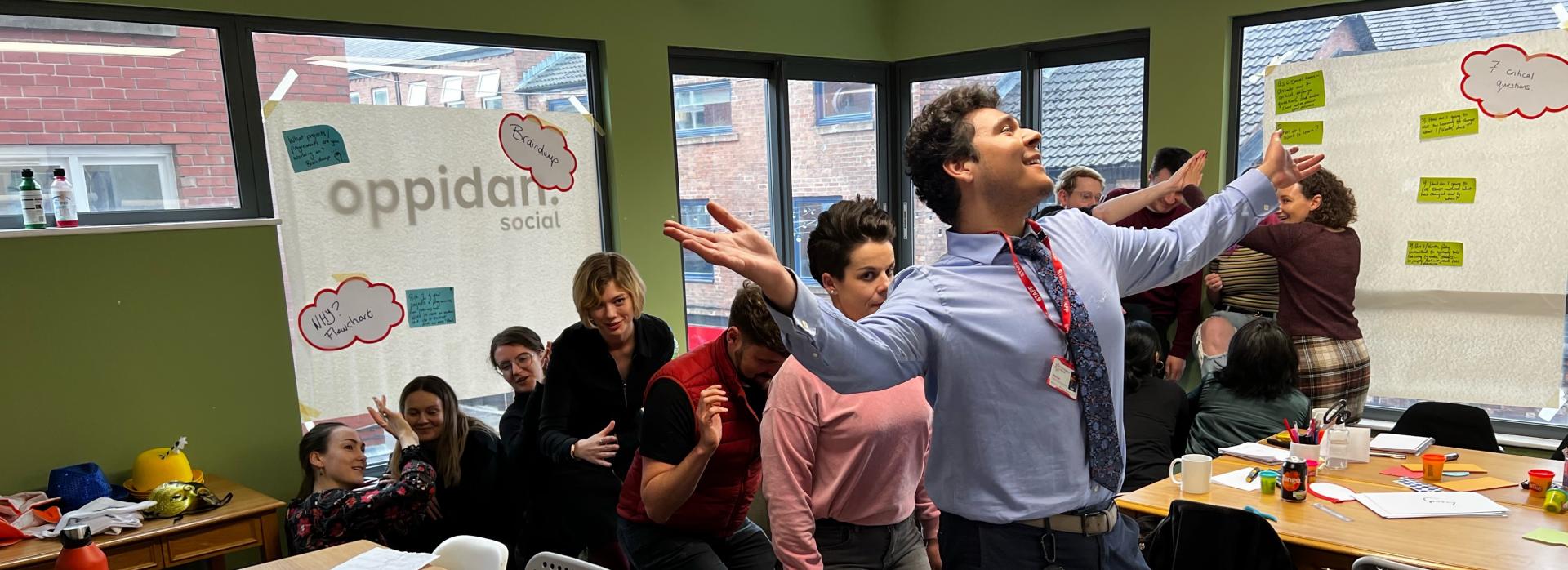 People moving in line in a green classroom