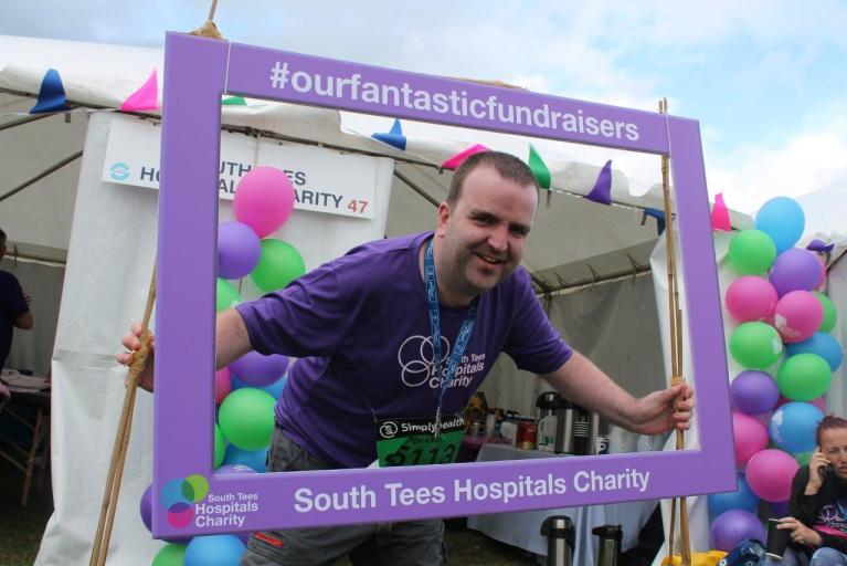 Richard celebrating after completing the Great North Run for James Cook Neuro- Rehabilitation Ward 26, Middlesborough ( South Tees Hospital NHS Trust)