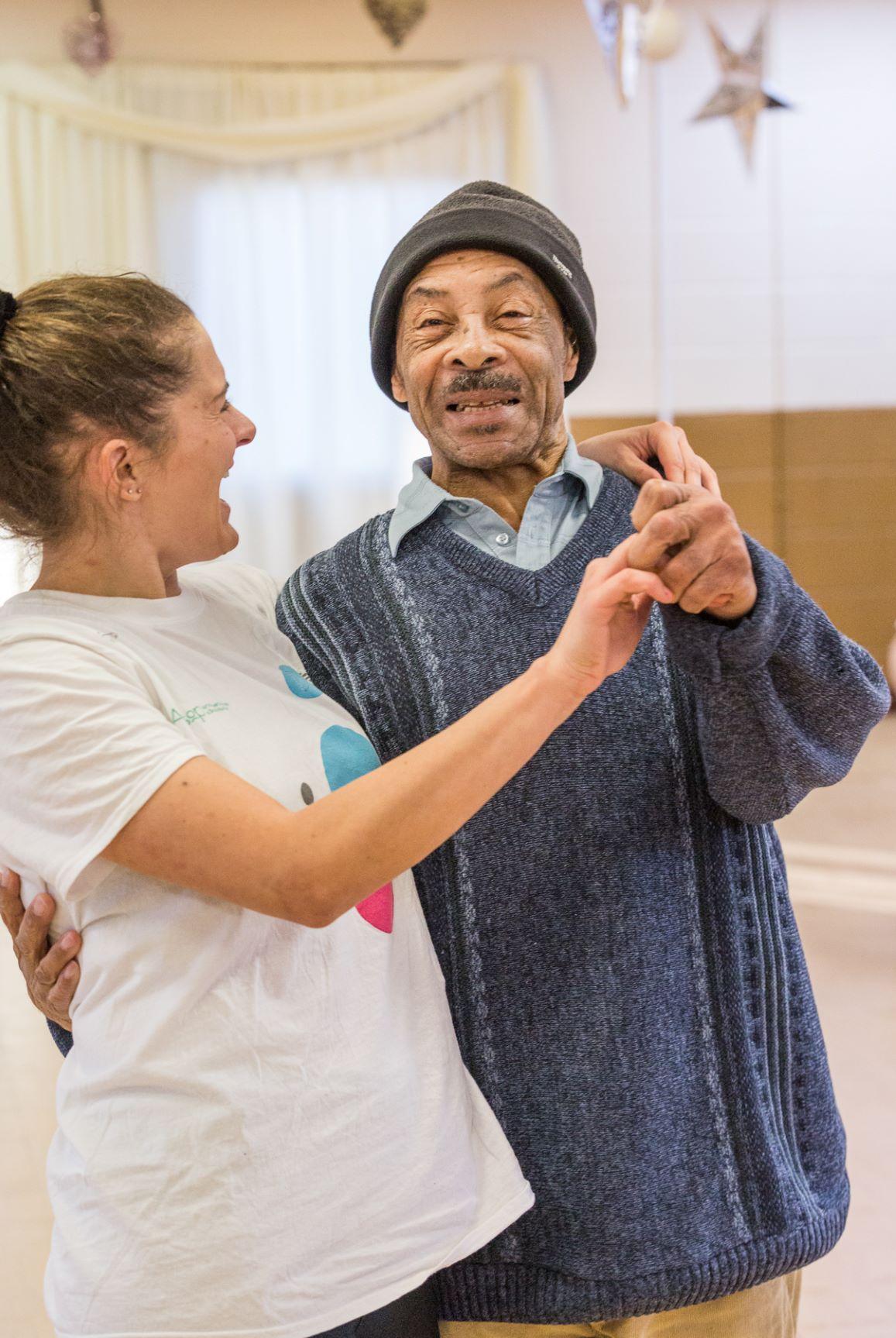 A man and woman dance together