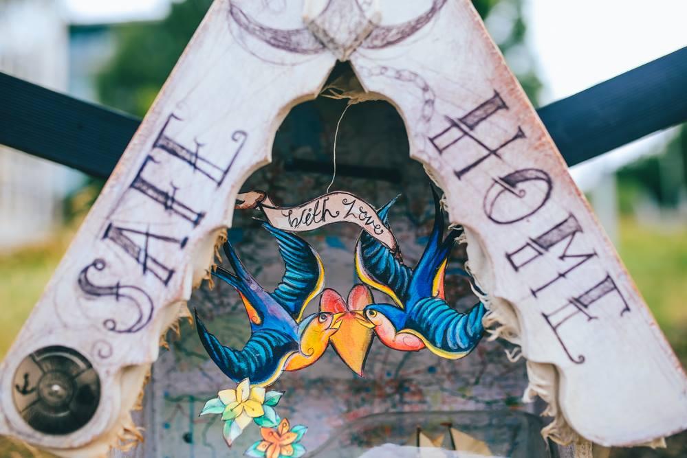 artwork featuring the words Safe and Home and two birds