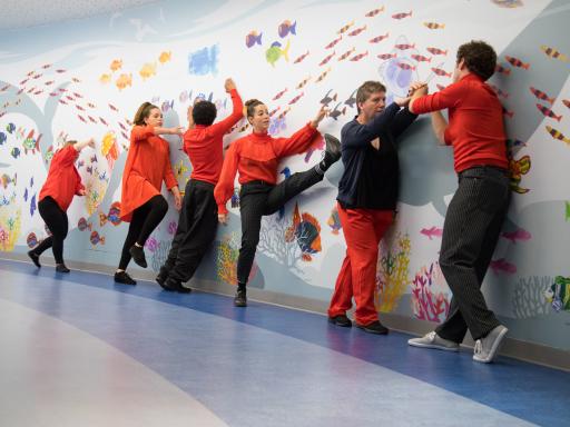 Corali Dance Company perform in front of the Sea Scape at the main entrace to Great Ormond Street Hospital