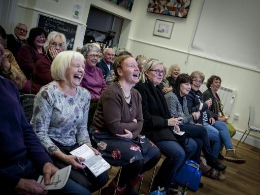 photograph by Trish Thompson of the audience laughing at a Creative Arts East touring event during Creativity & Wellbeing Week 2019