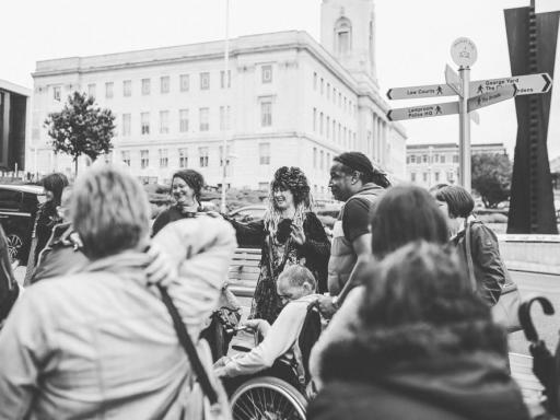 People taking part in the Spaces Between Walk (Creative Recovery) with Barnsley Town Hall in the background