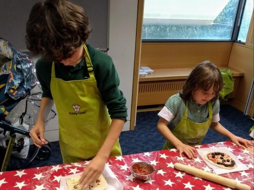 Two children cooking at Norfolk libraries