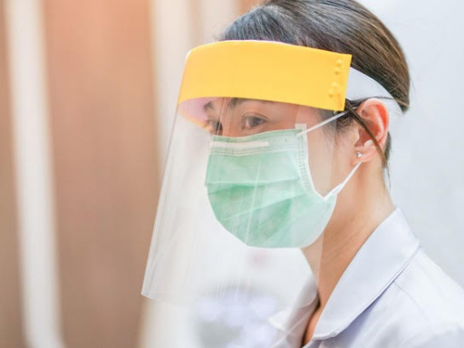 A nurse wearing personal protective equipment