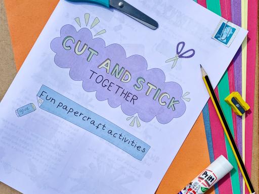 a photo of equipment from a creativity kit - instructions, scissors, glue, a pencil and sharpener