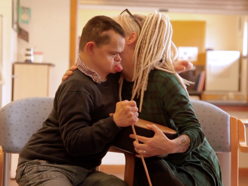 An embrace during a music session at The Montrose Centre