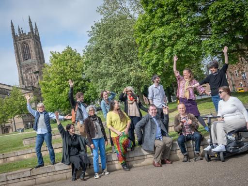 The LENs steering group and directors pose by a green space in central Derby