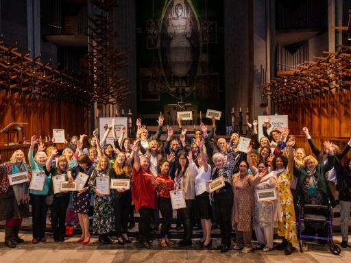 Creative Lives Awards 2020 and 2021 winners diverse group inside a cathedral celebrating