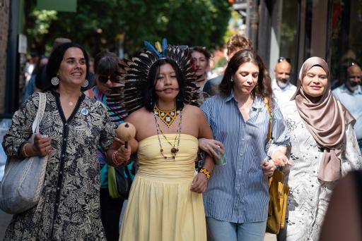 A group of women walking linking arms